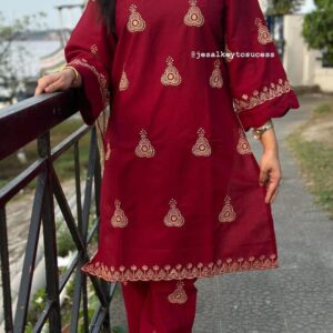 Pakistani three-piece suit with AC cotton kameez featuring jumka embroidery, a pure cotton printed dupatta, and matching embroidered pants. Available in sizes 38, 40, 42, and 44.